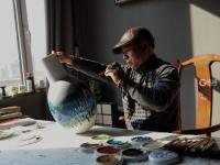 就地过年  画家村里翰墨飘香