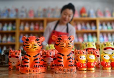 泥老虎、虎头鞋……“萌虎”贺岁回忆杀 