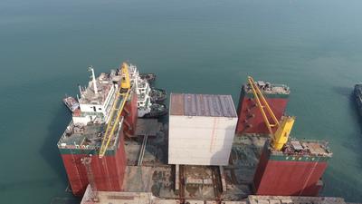 东防波堤延入深海！青岛港董家口港区胡家山作业区防波堤项目首个沉箱出运