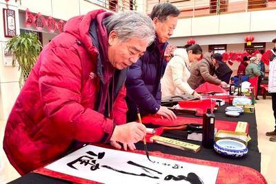 笔墨迎春、福进百家！民建青岛市委会送福进李沧区社会福利院